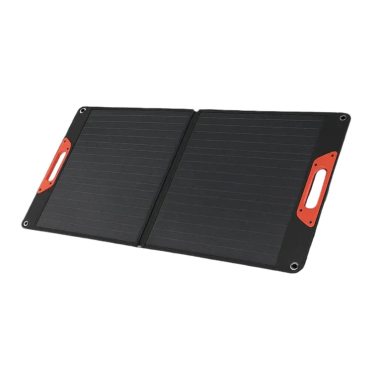 A foldable black solar panel backpack or power pack shown open on a solid black background, with bright orange-red handle accents on both sides and a small stand leg visible underneath.